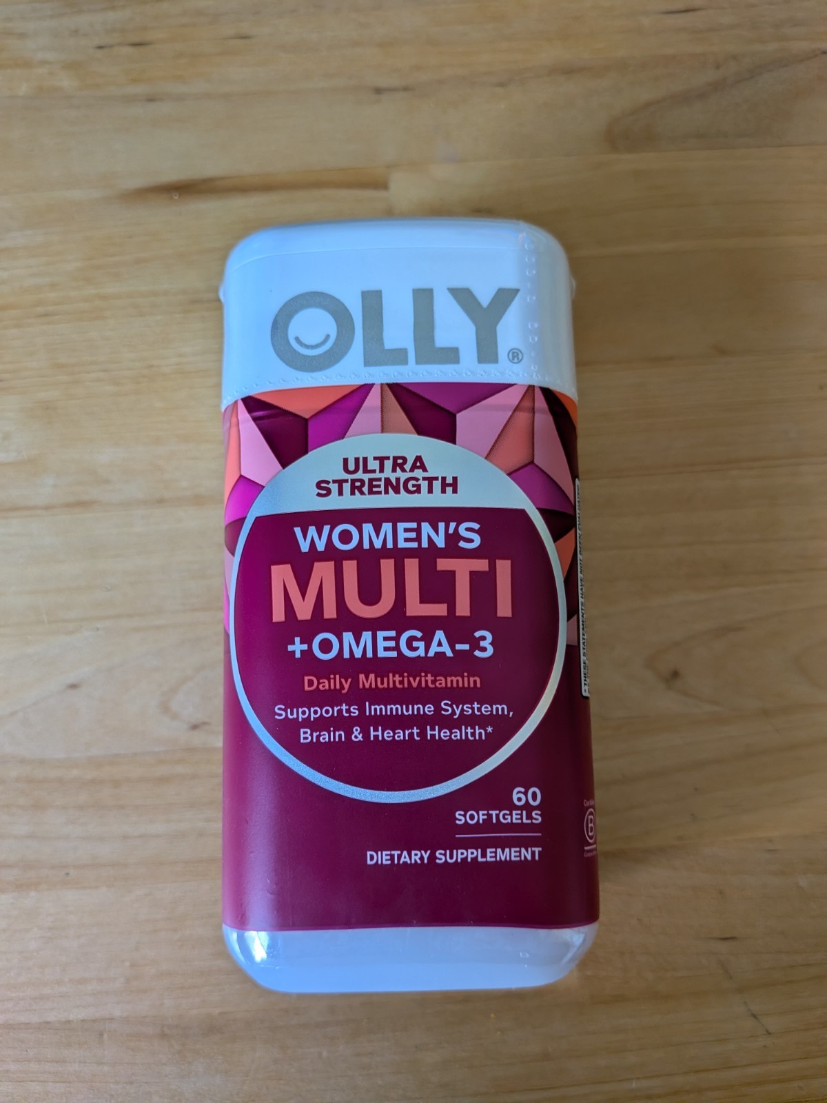 Olly Ultra Women’s Multi & Omega-3 Softgels 60-count seal expires March/2027